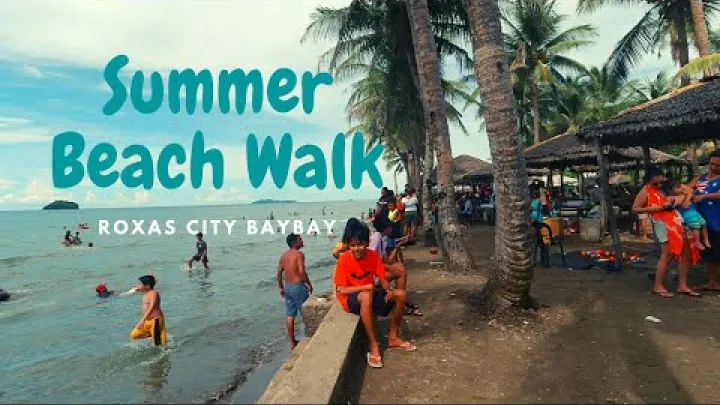 Preview image for the video "JALAN-JALAN DI PANTAI MUSIM PANAS / TELUK KOTA ROXAS - PENGEMBARA CAPIZ".